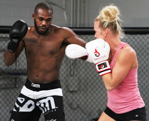 Holly Holm (L) is shown here sparring with her Team Jackson-Wink stable-mate,   UFC champion Jon Jones. 